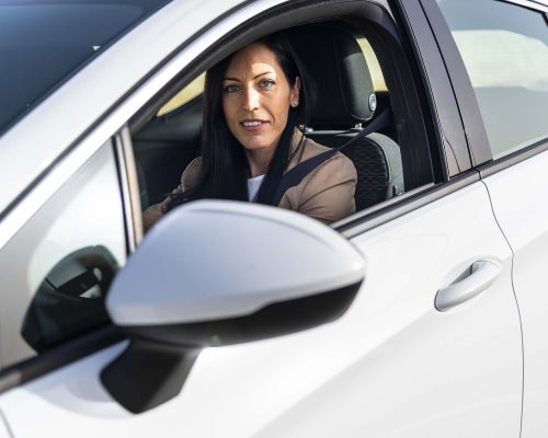 Executive Travel: Businesswoman Renting a Luxury Car at Airport