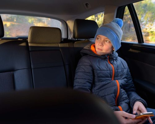 Portrait of young handsome boy ready for road trip in Finland